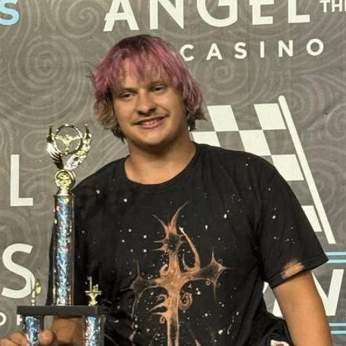 Dakota Wilkinson standing on the podium with his trophy after winning 60 minutes of fear