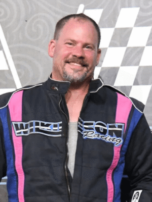 Doug Wilkinson standing on the podium after completing a race