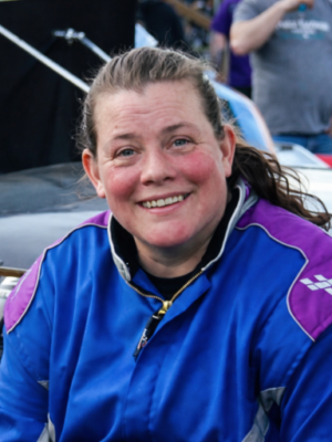 Jessica Wilkinson sitting on her car during fan fest before a race