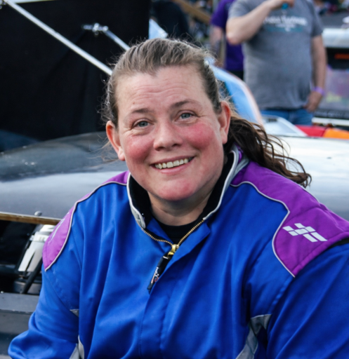 Jessica Wilkinson sitting on her car during fan fest before a race